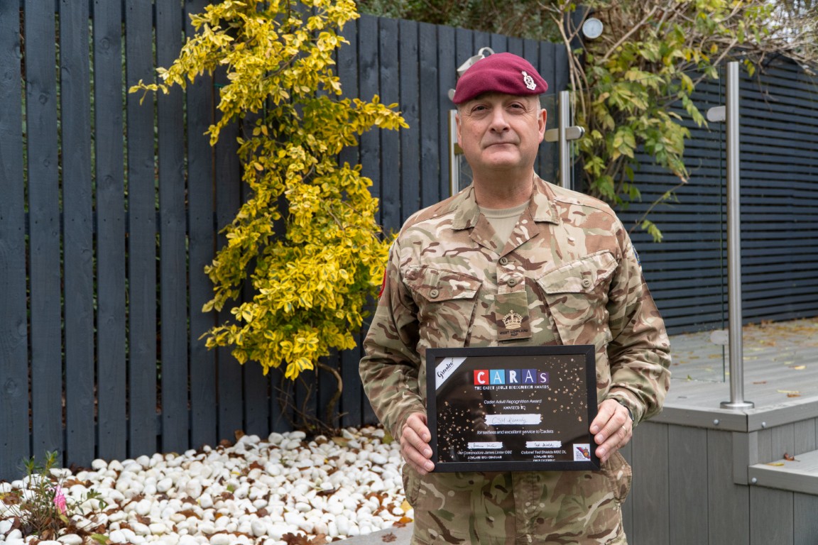 Company Sergeant Major Frank Kennedy holding his CARAs award