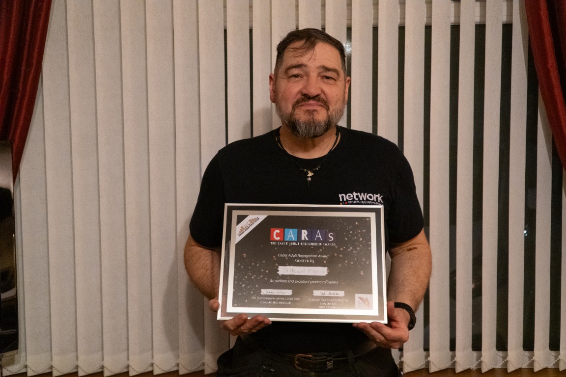 Sergeant Michael McKeown holding his CARAs award